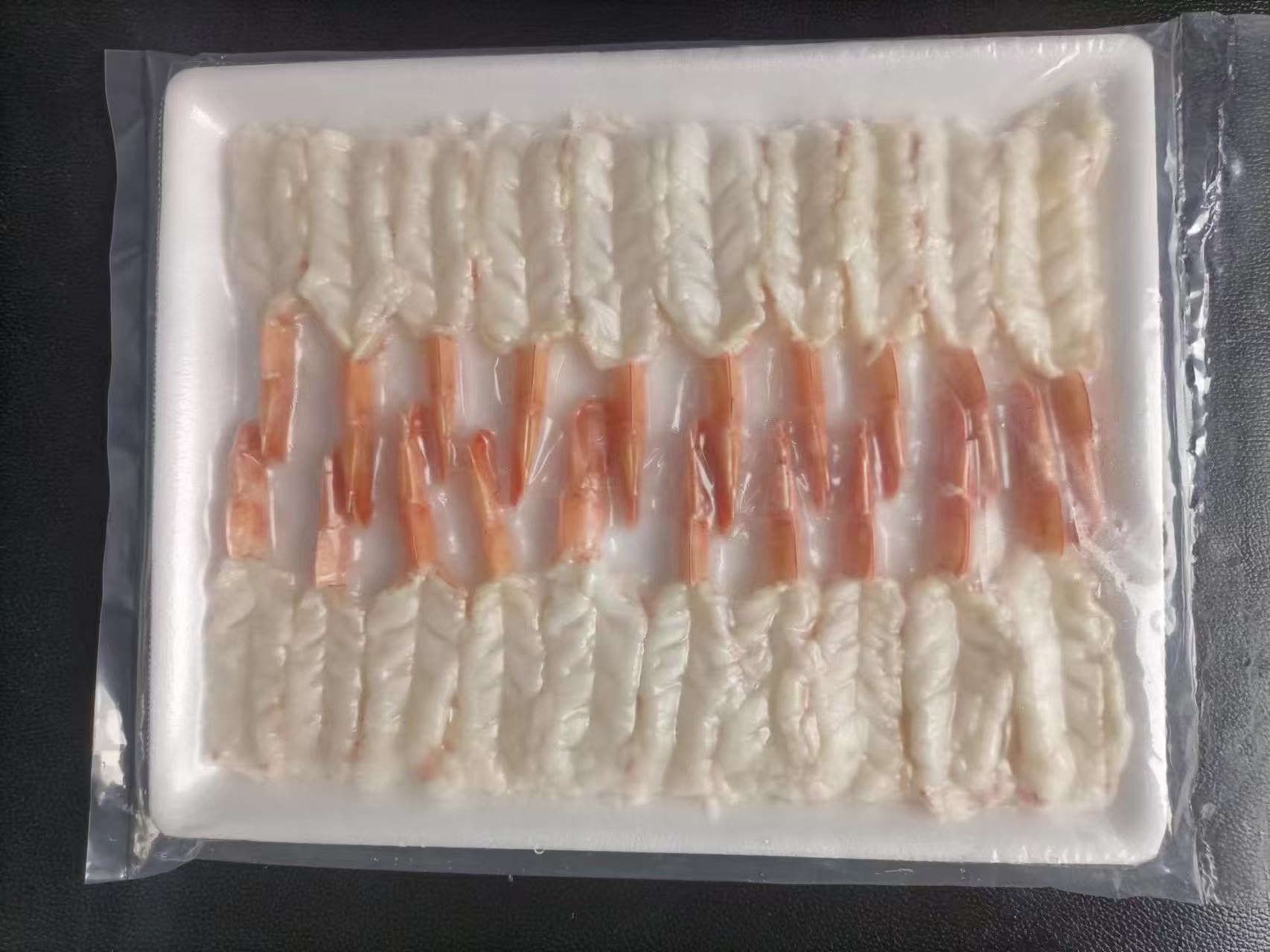 Hand-stretched nobashi shrimp, tray-packed for HoReCa.